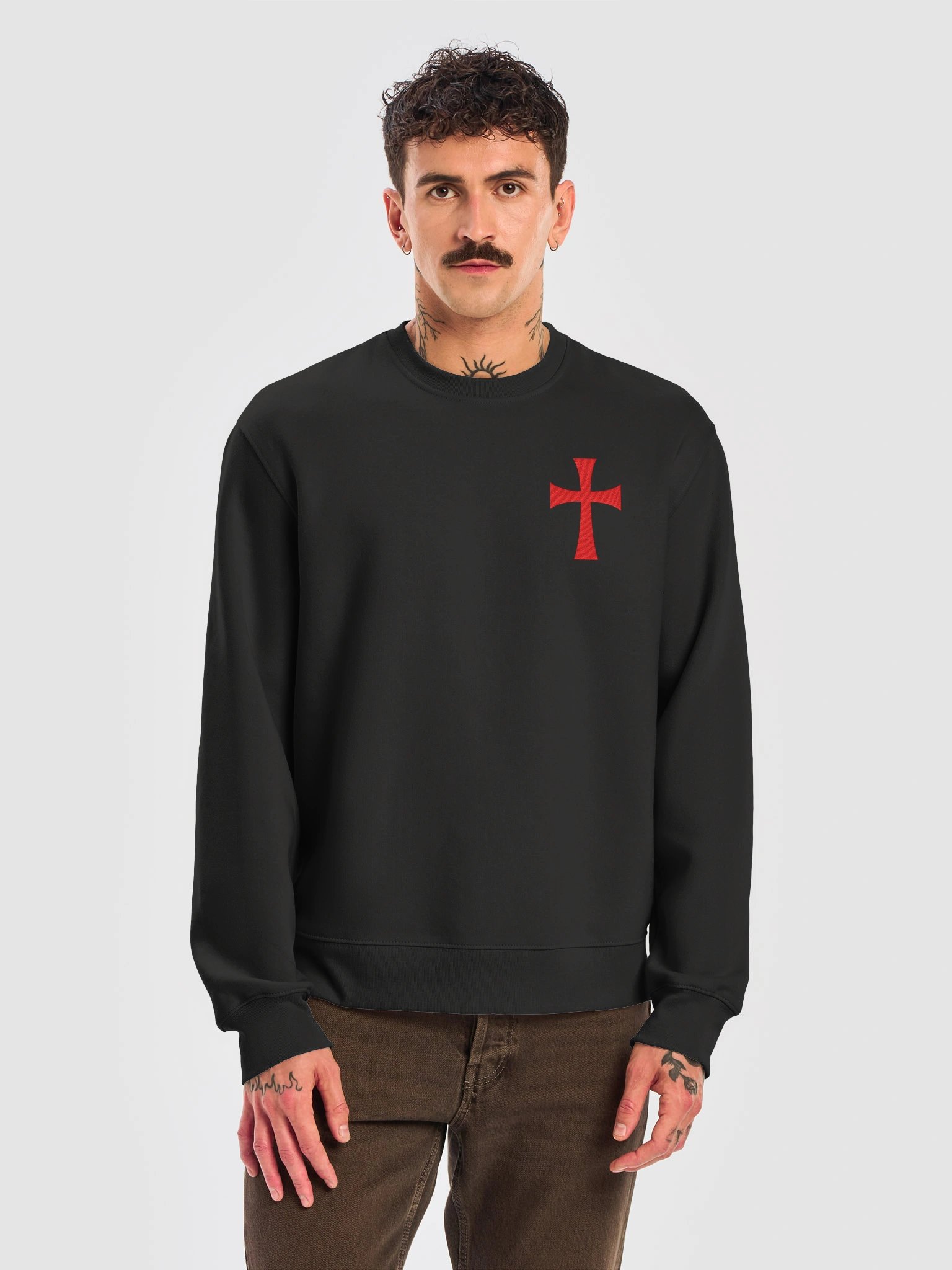 The Standard crewneck in black with the red flared cross over the heart
