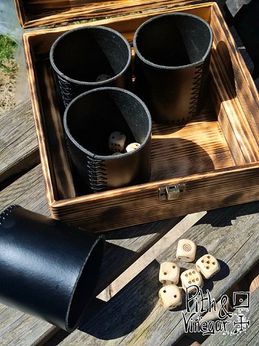You’re not here for a quick round. You’re here for the game.

This Liars Dice set comes in its own wooden box, with leather c...