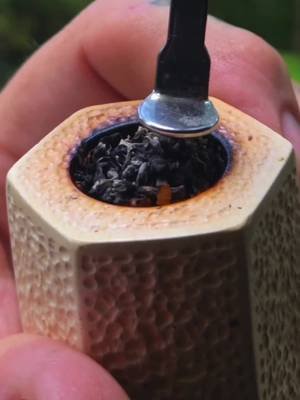 The key to keeping your tobacco pipe lit is twofold, a proper false light and learning to use your tamper... The false light is important because as soon as you light your tobacco, it expands and becomes a little looser. That's why the first thing you should do is gently tamp it back down. The benefit is that you're creating a layer of ash across the top of the bowl. Think of it like a blanket. That layer helps insulate the embers underneath, so when you relight, those embers can keep burning and your pipe stays lit longer. That's the purpose of the false light. From that point on, all you're doing is enjoying your pipe and periodically using your tamper to gently press the ash back down, keeping that protective layer compact. As the ember works its way down through the bowl, that ash layer continues to protect it, helping it burn more evenly and stay lit longer. And thats the trick to keeping a tobacco pipe lit. #Pipesmoking #tobaccopipes #tobaccopipe #ytpc #pipesmokers