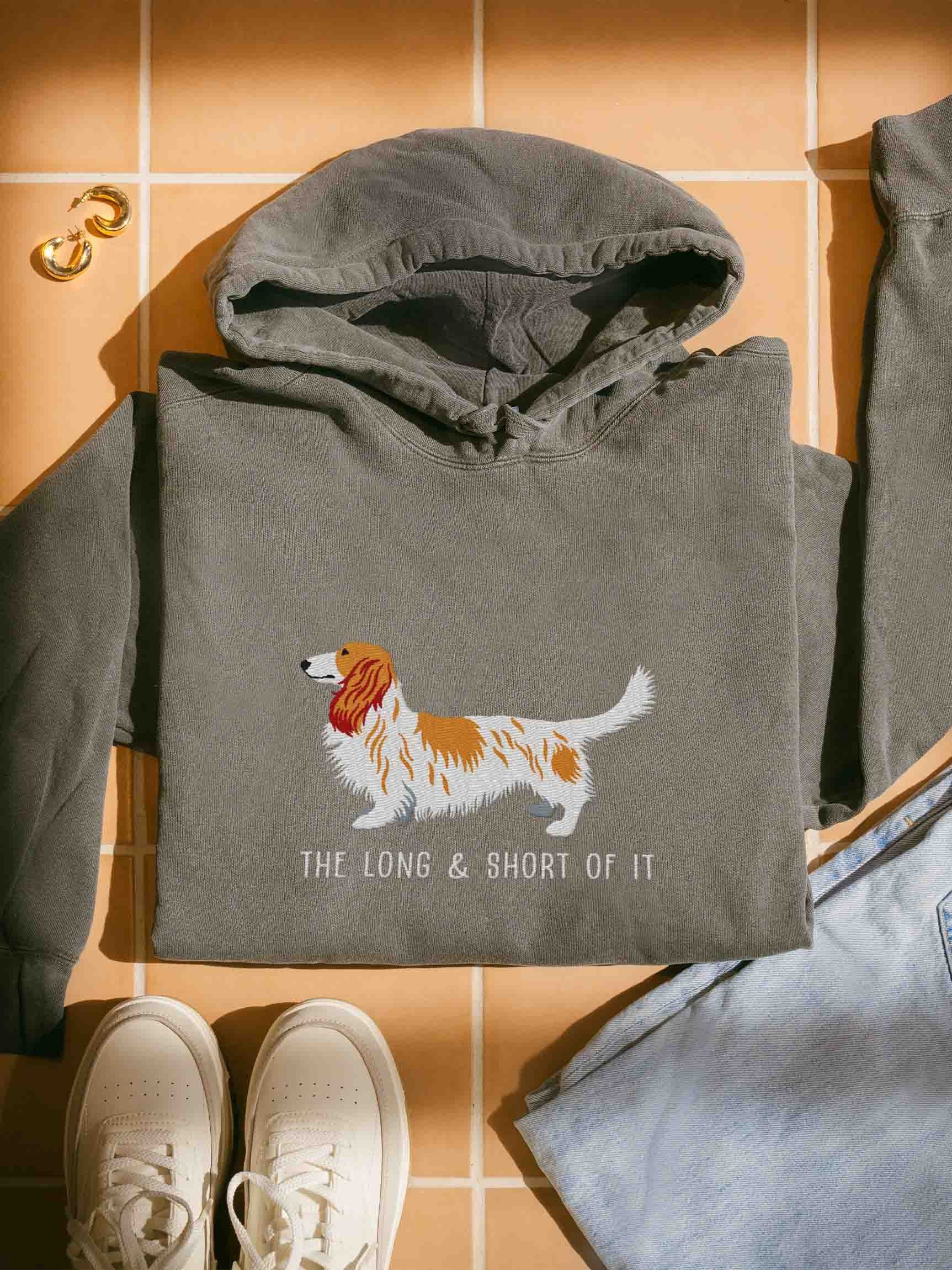 The Long & Short of It Premium Hoodie (Embroidered) of a Longhaired Dachshund(Pied Brown & White) product image (1)