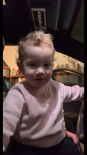 Drivin with her dad! Notice the fake sadness after being told no!