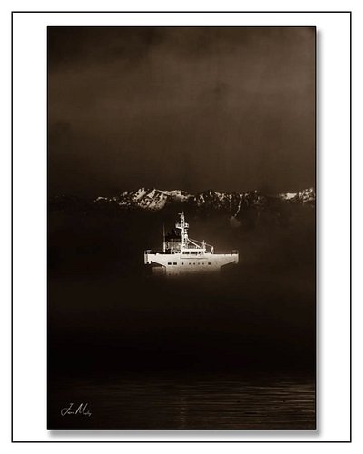 A ship materializes through the fog in Elliott Bay — Olympic peaks breaking through the clouds above, dark water below. Sepia...