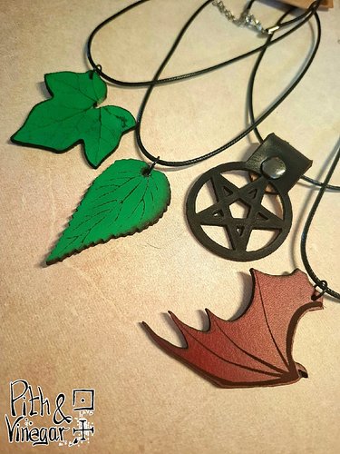 Want some adventure, chaos, and goblin energy you can wear every day?

My leather oak leaves now have company: ivy and nettle...