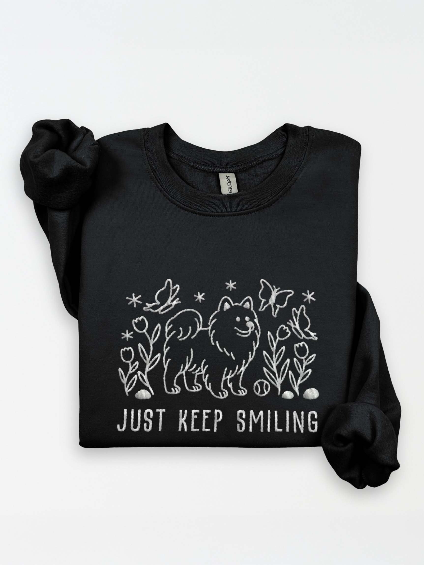 Just Keep Smiling Line Art Sweatshirt (Embroidered) of a Samoyed product image (1)