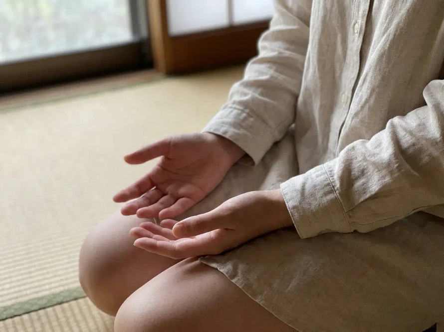 Hands resting in lap