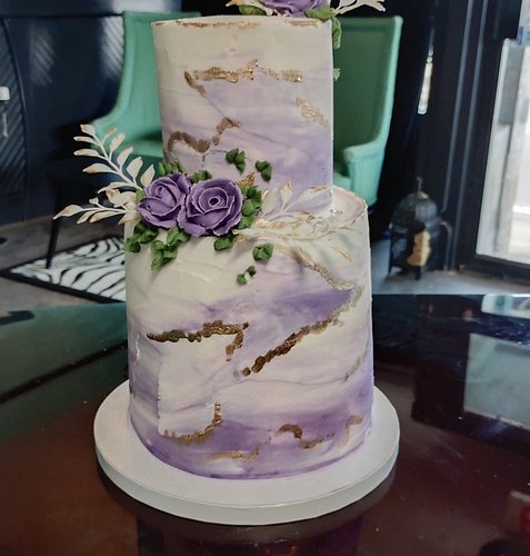 Mini 4x6 wedding cake with a buttercream water color effect, gold detailing and buttercream flowers. We're open til 6 tonight...