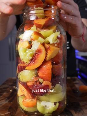 I think I’m officially obsessed with fermenting fruit. 🍑🌶️ Peaches + hot peppers + garlic → fermented hot sauce. My free fermentation starter guide is in my bio if you want to start fermenting at home. #fermentation #hotsauce #fermentedfoods #peaches #realfood