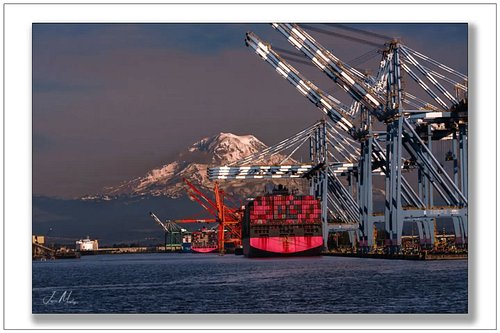 ONE container ship at the Port of Tacoma — those iconic magenta containers stacked under the gantry cranes with Mt. Rainier g...
