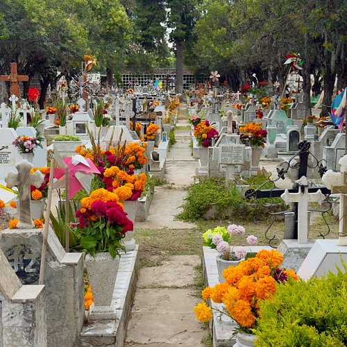 On Día de Muertos, Puebla’s municipal cemetery fills with flowers, mariachis, food, and families spending the day with their ...