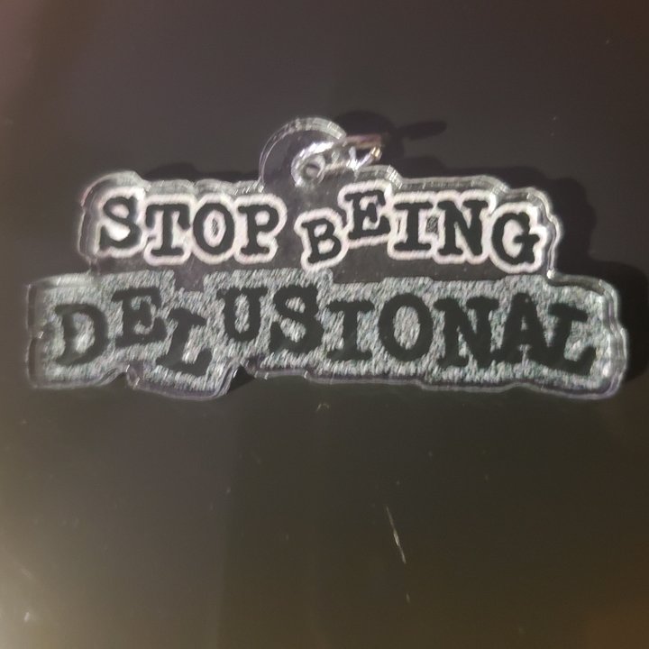 Stop Being Delusional Charm product image (1)