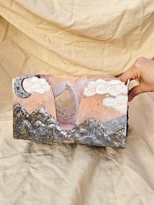 Turning cardboard into functional art ✨️ I made this dreamy paper towel &napkin holder from recycled materials and lots of imagination 🌜🏔♻️  Who says practical things can't be magical? #cardboardcrafts #craftswithrecycledmaterials #functionalart #recycledcrafts 