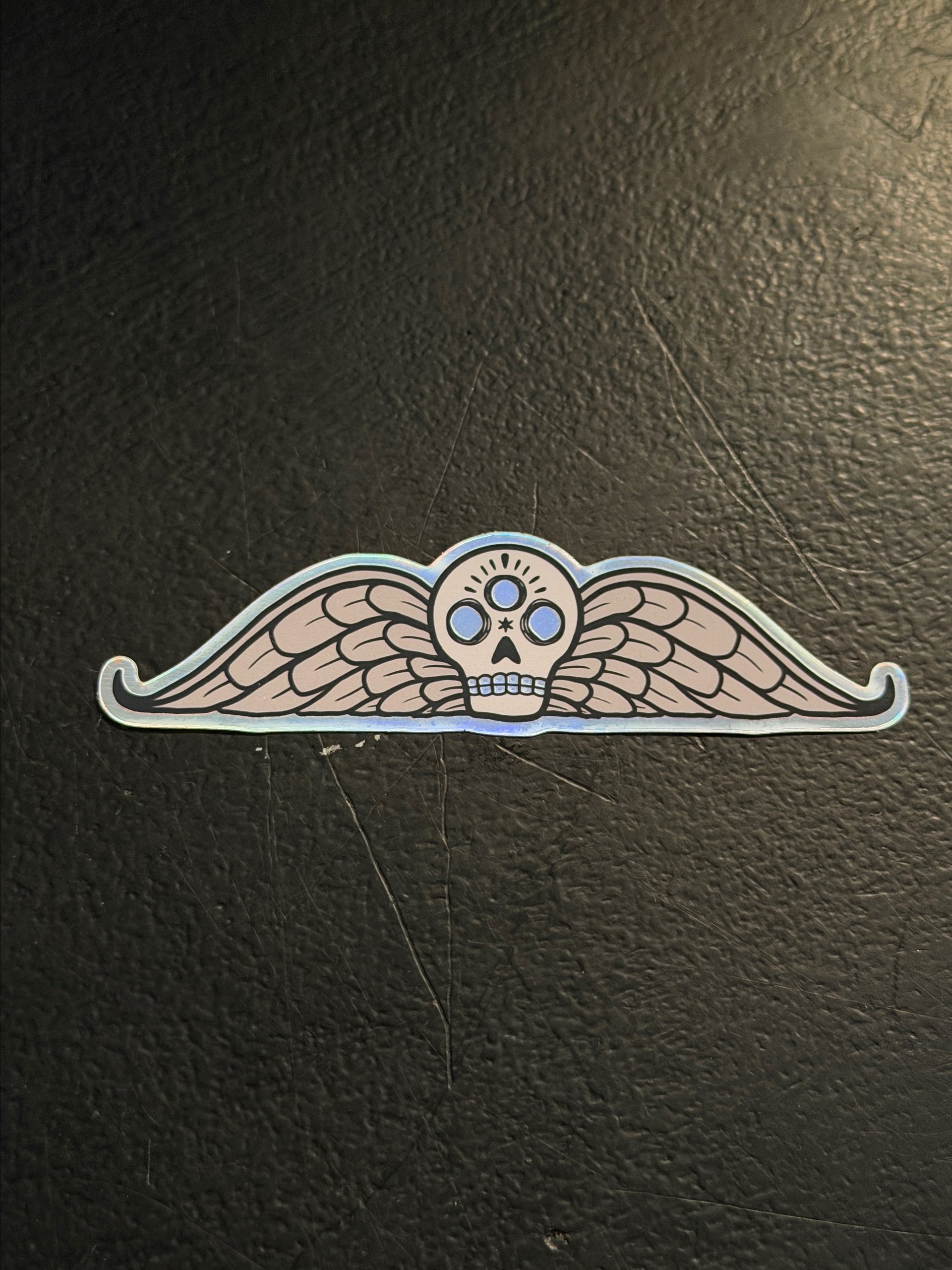 Winged Memento Holographic Sticker product image (1)