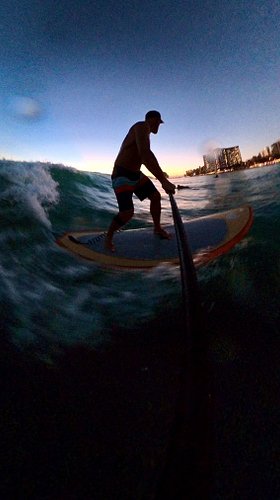 Sunset surfing hits different in Hawaii. 🌊

Warm water, city lights, and one more wave until well after dark. More of this, p...