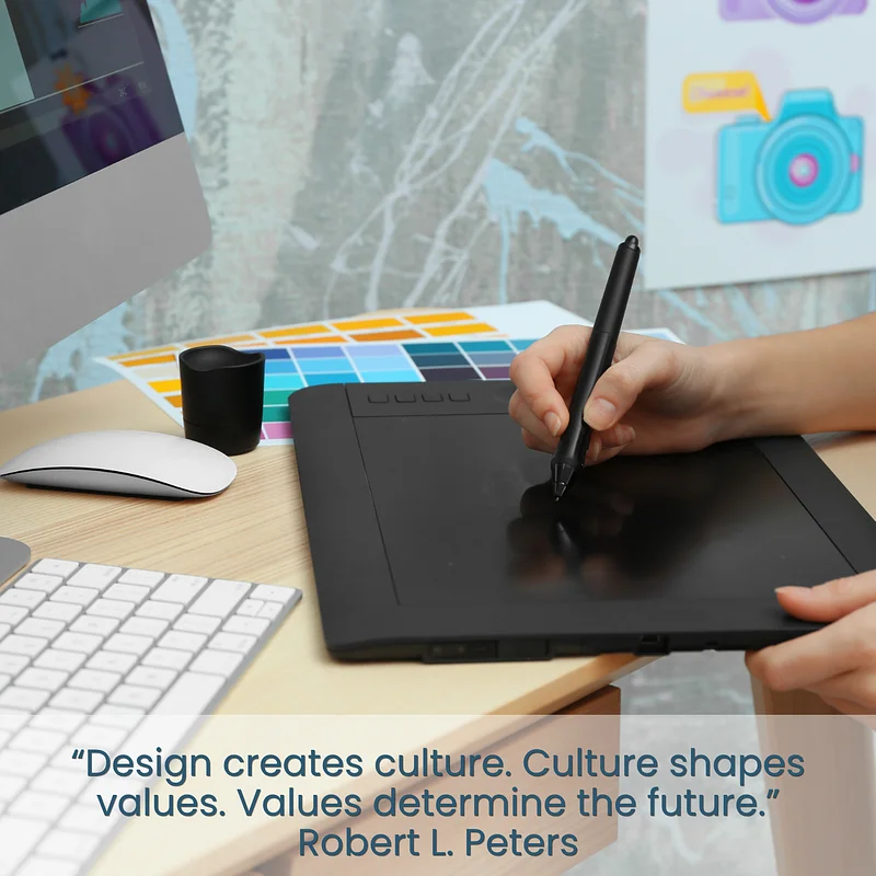 This image shows the desk of a graphic designer and a quote from Robert L. Peters that states, "Design creates culture. Culture shapes values. Values determine the future."