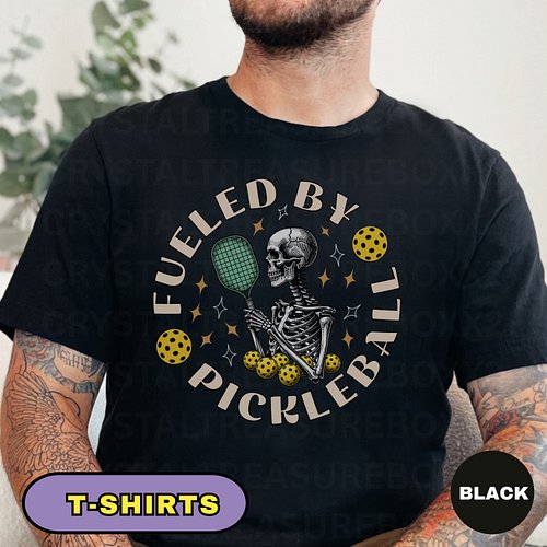 This “Fueled By Pickleball” shirt features a bold skeleton design holding a pickleball racket, perfect for players who live f...