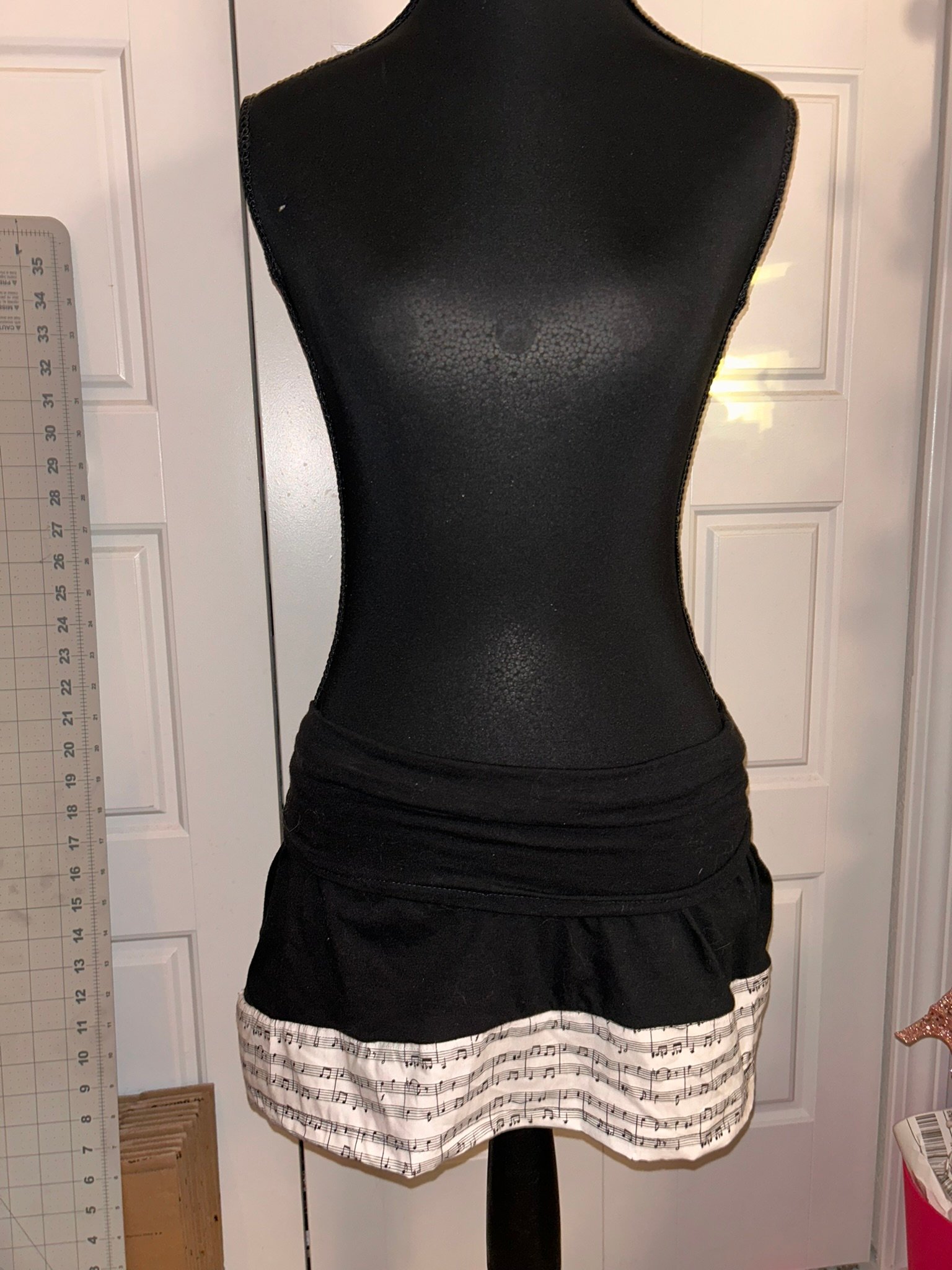 Black stretchy skirt with music note trim product image (1)