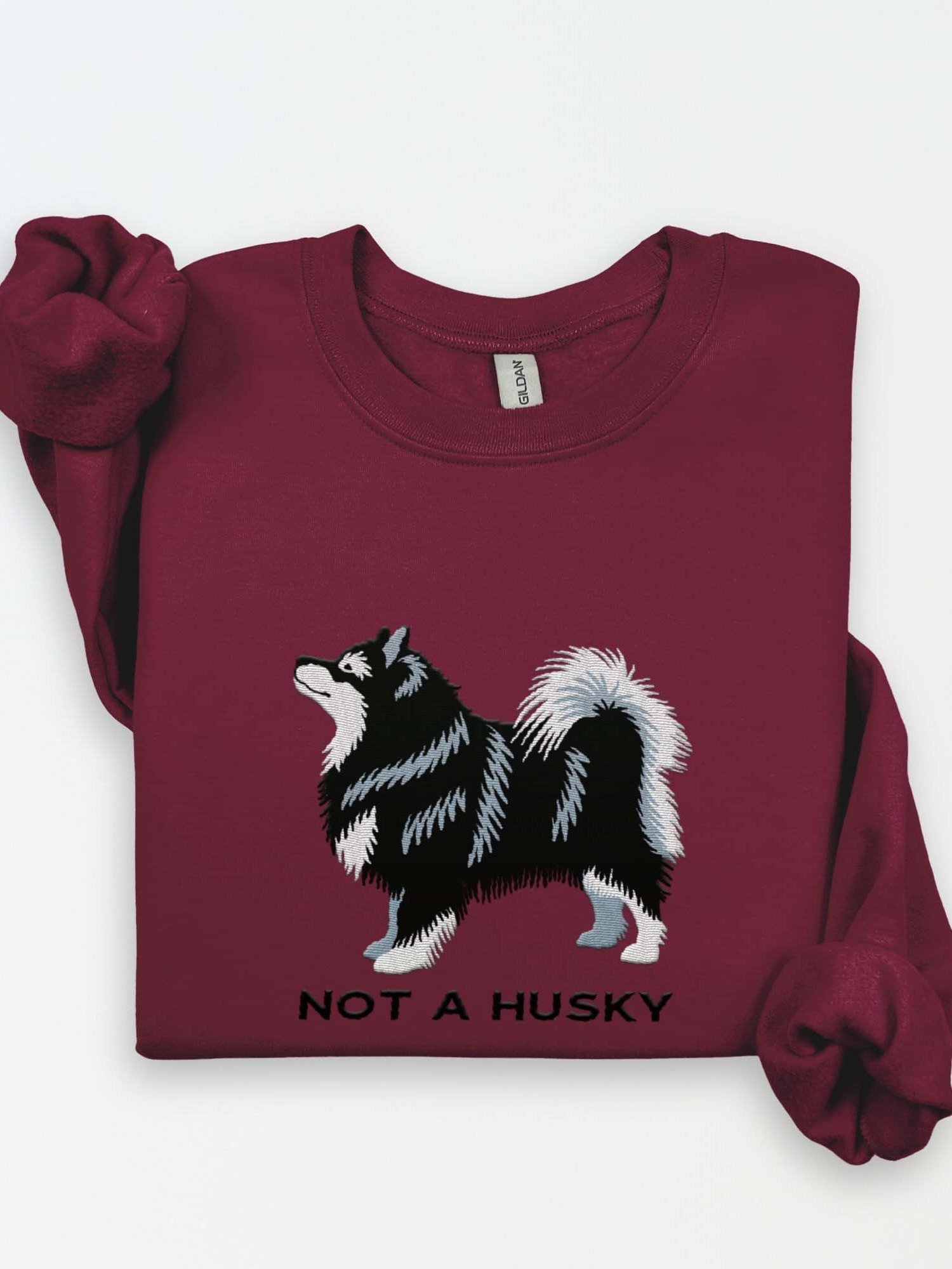 Not a Husky Sweatshirt (Embroidered) of a Finnish Lapphund(Black) product image (1)