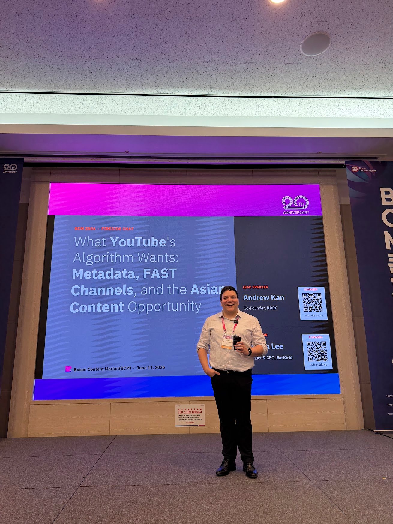 Andrew Kan beside the session title slide listing him as Lead Speaker at the Busan Content Market
