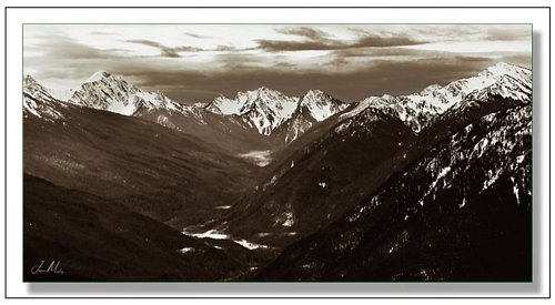 Looking down into the Upper Elwha from Hurricane Ridge—snow, shadow, and endless ridgelines fading into the distance. The Oly...