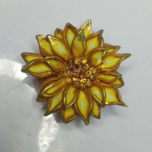 I've continued to work on my #geode inspired #polymerclay #sunflowers. I added gold shimmer and chrome paint. It will be so s...
