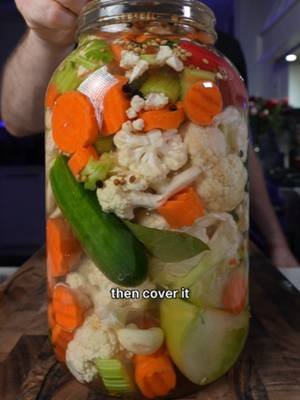 Seven different fermented vegetables in one jar. Celery, green tomato, cucumber, cauliflower, carrots, sweet + hot peppers, garlic and spices covered with a 3% salt brine. Basically my fermented version of giardiniera. Full fermentation system linked in my bio. #fermentation #giardiniera #fermentedvegetables #fermentedfoods #realfood #dishbydavid