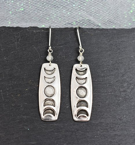 Celebrate the rhythm of transformation with these sterling silver Lunar Phases Earrings. Each handcrafted rectangle captures ...