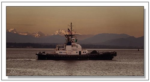 Crowley's Tug Response in the San Juan Islands — flag flying, Cascades glowing behind her, wildfire-haze sky turning everythi...