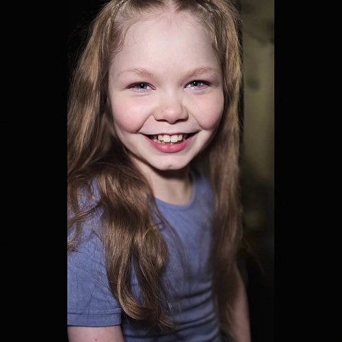 Photo taken with my cell phone yesterday. Testing out a  clip on light to see if it would put a bit of light into Ana's eyes ...
