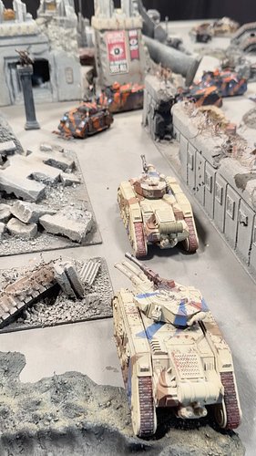 This is what our next 40k livestream battle is going to look like.

Ruined city streets. Leman Russ tanks facing off against ...