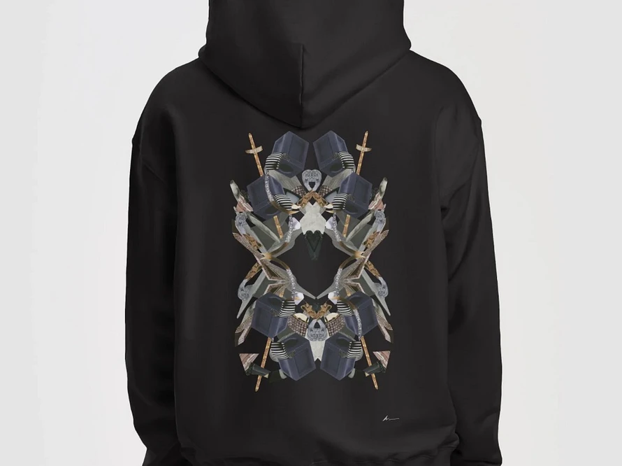 AS IS AND Assembly 001 collection featuring an oversized hoodie and t-shirt displayed in a minimalist architectural space, representing contemporary luxury fashion and intentional design.