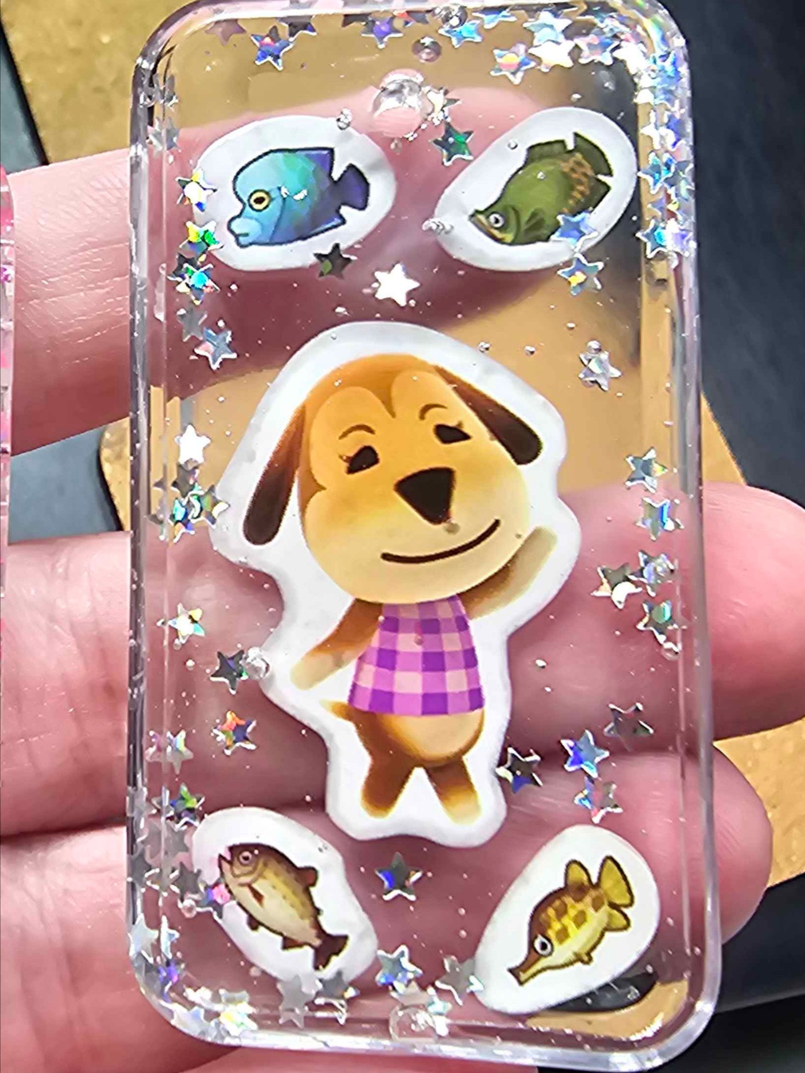 AC stickers suspended in resin keychains product image (1)
