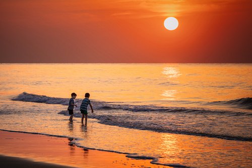 Welcoming the day at the water’s edge. Early morning exploration under a burning sunrise.