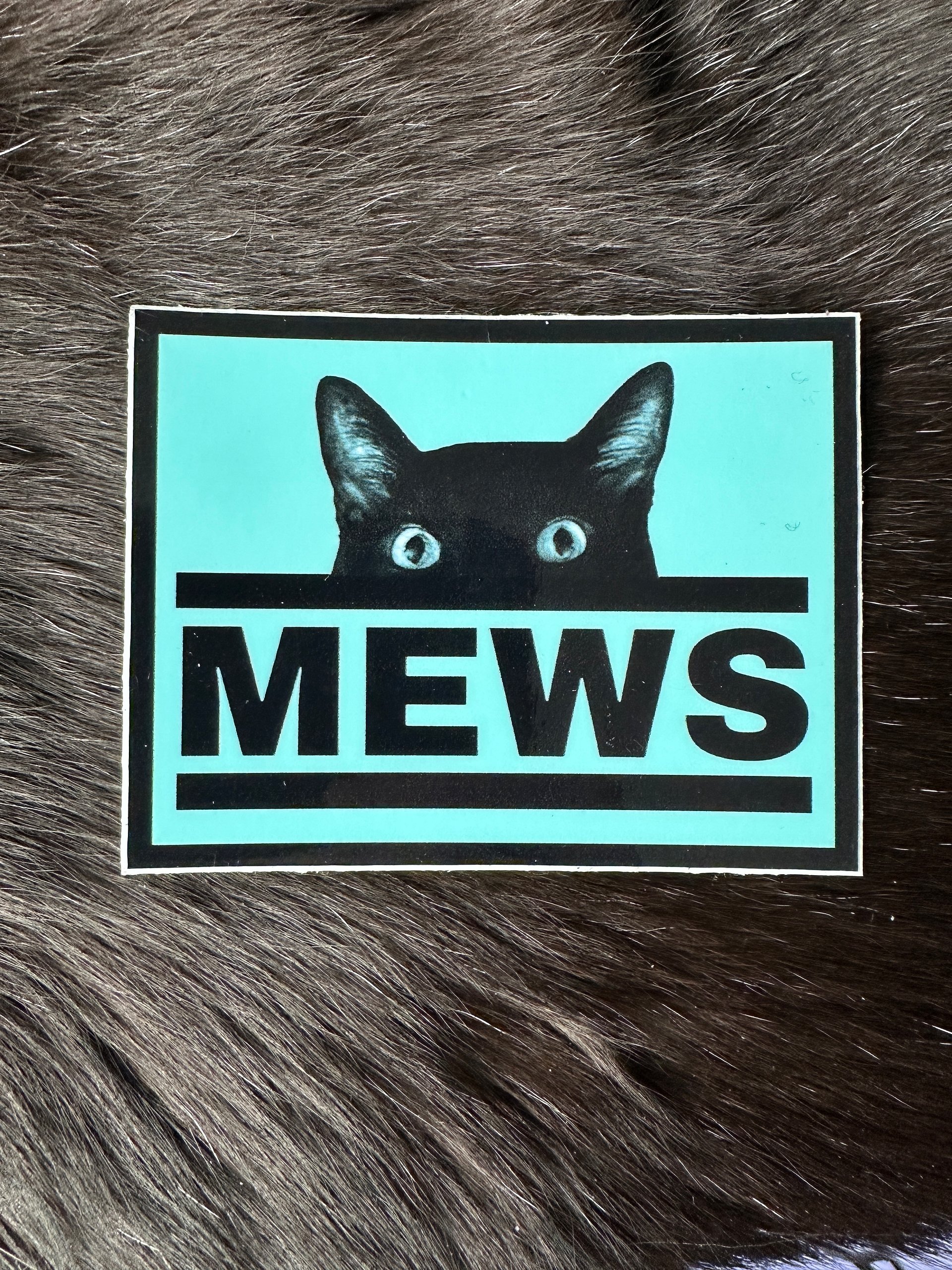 Manny MEWS logo sticker product image (1)