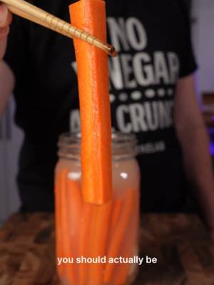 Baby carrots are one of the most processed vegetables in your fridge. Full method in bio 👆 They're not even a real carrot. Shaved down rejects, bleached, sitting in chlorine water to stay fresh. Most people are snacking on that every day without knowing. Here is what you should be snacking on instead. Real carrots fermented in garlic, mustard seeds, bay leaves. 3-5 days. They come out crunchy, tangy, garlicky, alive with beneficial gut bacteria. Nothing processed. Nothing bleached. Nothing sitting in chlorine water. Once you've had a fermented carrot, going back to baby carrots is hard to do. #fermentedcarrots #fermentation #fermentedfoods #probiotics #guthealth #babycarrots #realfood #dishbydavid #brinelab