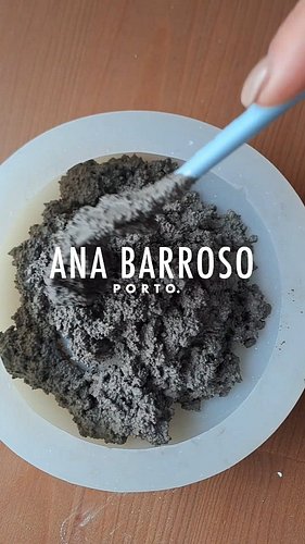 Mixing black stones with cement 🩶