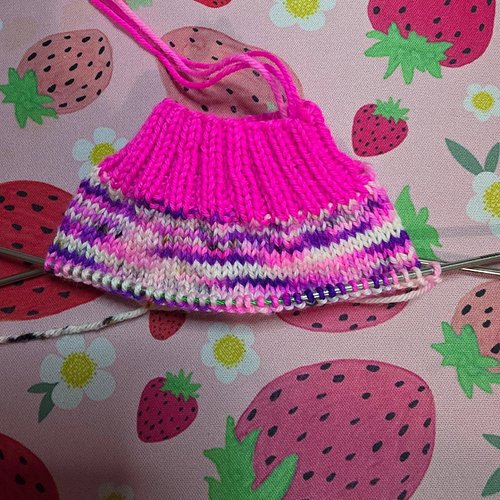 We decided to rip the sock and start over with the hot pink as the cuff!