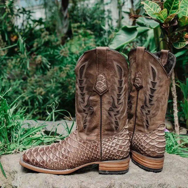 These extraordinary python print cowboy boots are crafted from genuine leather with an exotic design that looks and feels like real snakeskin. If you’re ready to add a tough country edge to your getup… this is your pair. Step different. Walk louder.  Shop now at sandtrailhatco.com #cowboyboots #westernstyle #countryfashion #exotic 