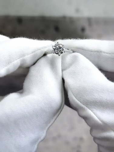There is something about a classic six-prong solitaire that never loses its magic. This piece features a beautiful 1.26ct nat...