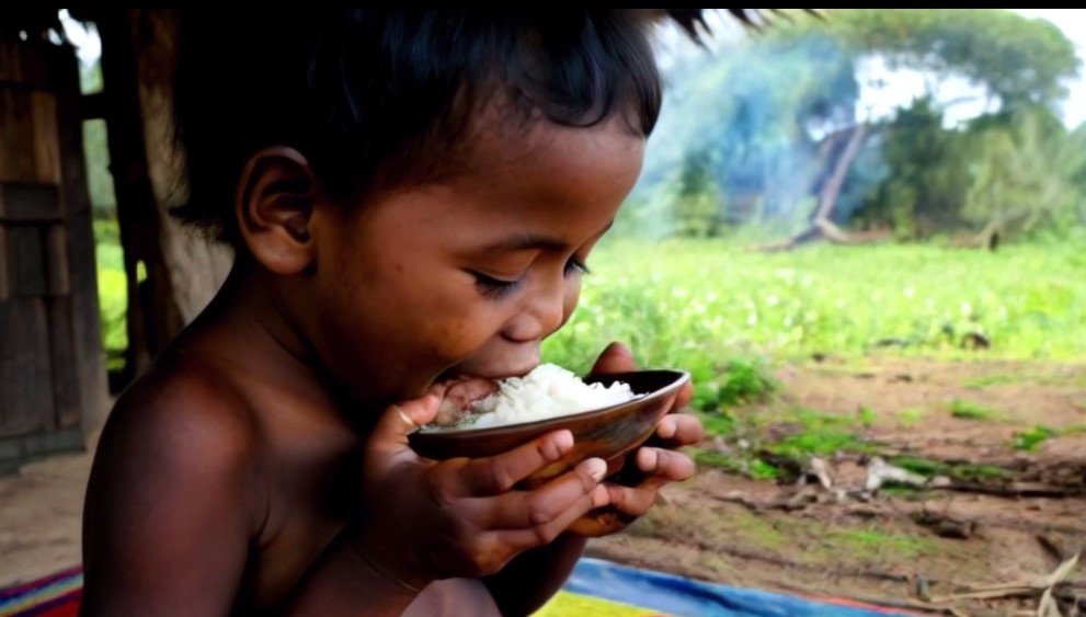 A child eating Rice from a Bowl 4K Generative AI for Personal and Commercial Use product image (1)