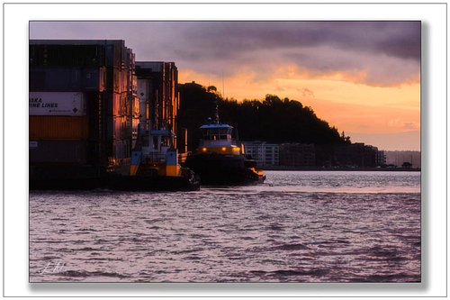 Sunset shift in Elliott Bay. Western tugs easing a barge through the glow—power, precision, and Pacific Northwest light doing...