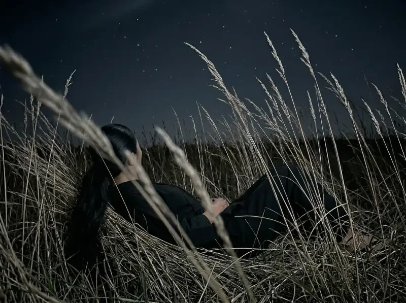 Woman lying in grass