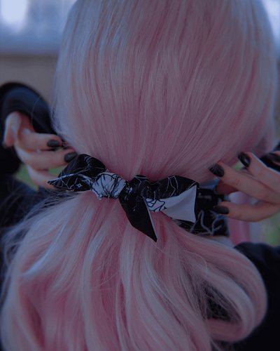 A subtle piece of darkness for your everyday rituals.

This black-and-white scrunchie from the Dead Moon collection is more t...