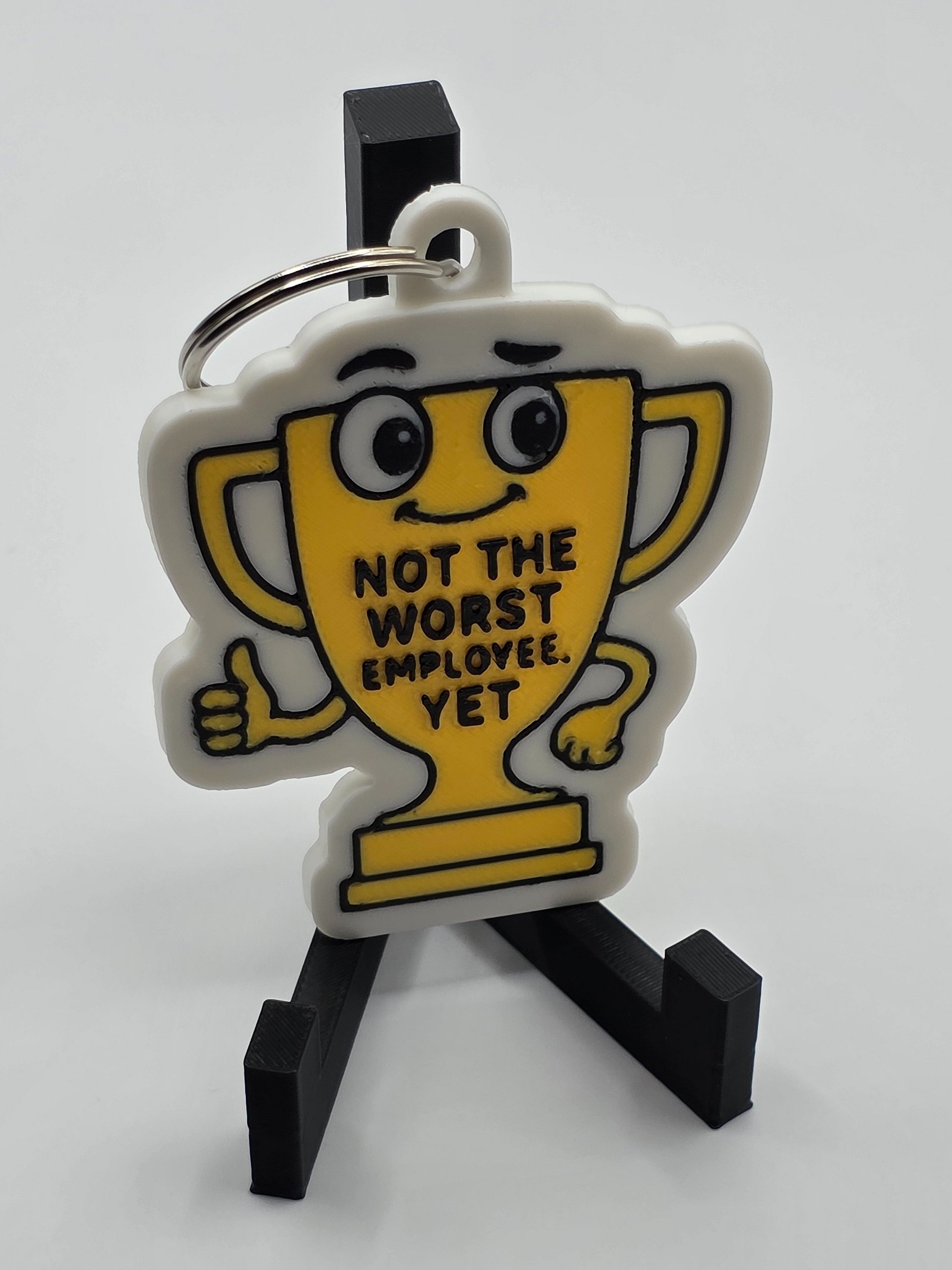 🏆 “Not the Worst Employee, Yet” Trophy Keychain product image (3)