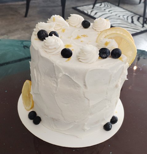 Gluten free Lemon Blueberry cake with lemon curd and marscapone cream filling and cream cheese frosting. #cakevixenssta #cust...